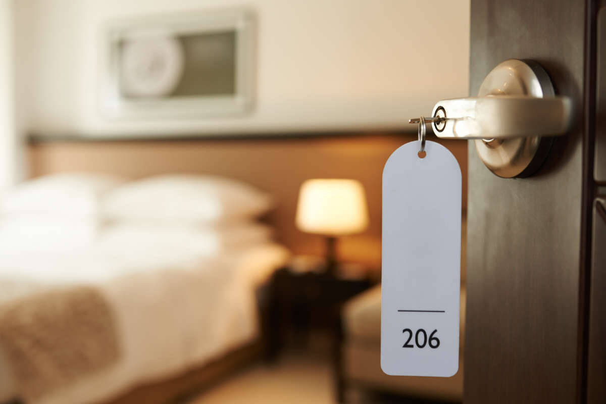 Hotel room door with key